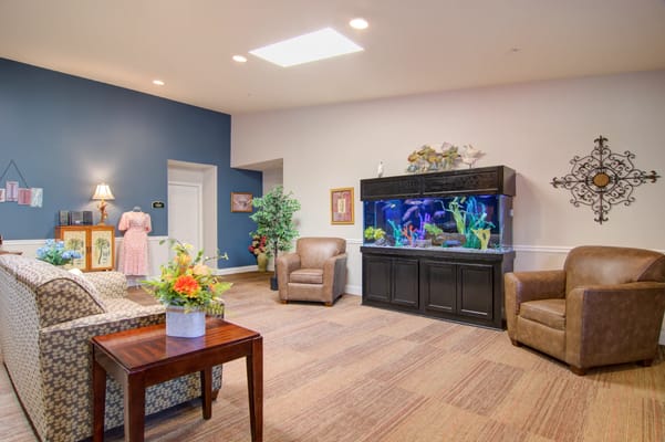 Interior view of a common area with seating and an aquarium