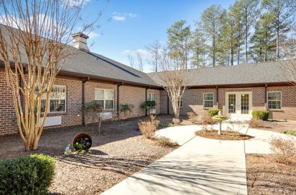 Outdoor courtyard with landscaped garden and building entrance