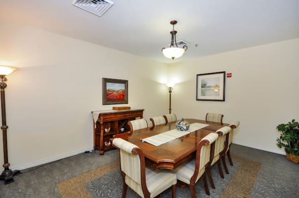 Interior dining room with a long table and chairs