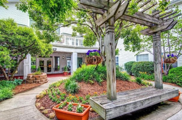 Outdoor seating area with garden and greenery