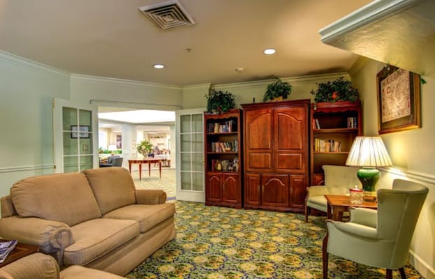 Cozy common area with seating and bookshelves