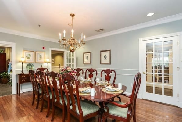 Elegant dining room with a long table set for guests