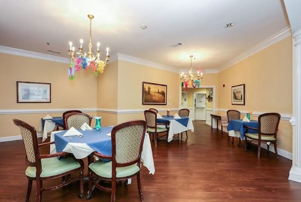 Dining room with tables set for residents