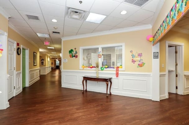 Bright, well-decorated hallway in a care facility