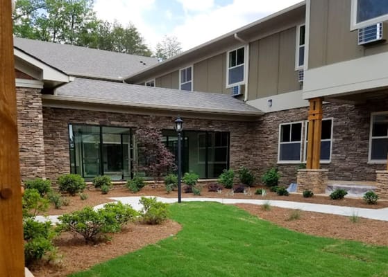 Exterior view of the facility with landscaped garden