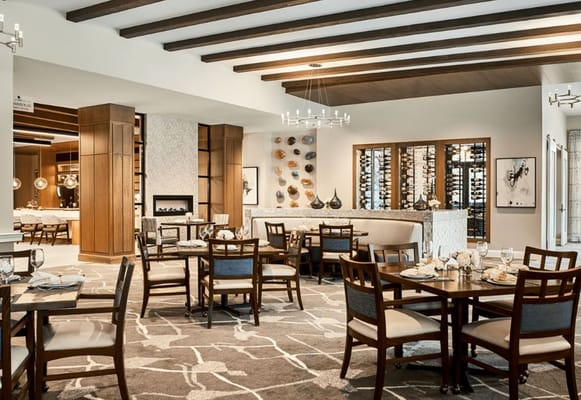 Elegant dining room with tables set for meals