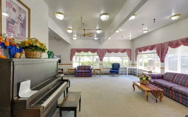 Interior common area with seating and a piano