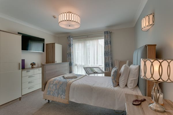 A well-furnished resident room with a view