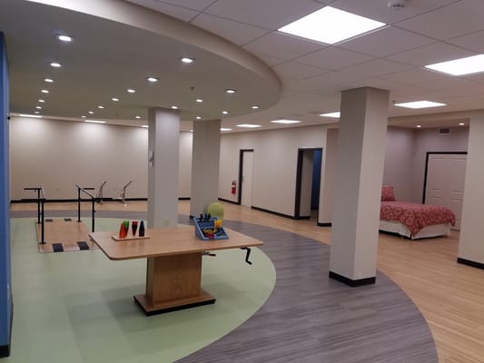 Brightly lit activity room with equipment