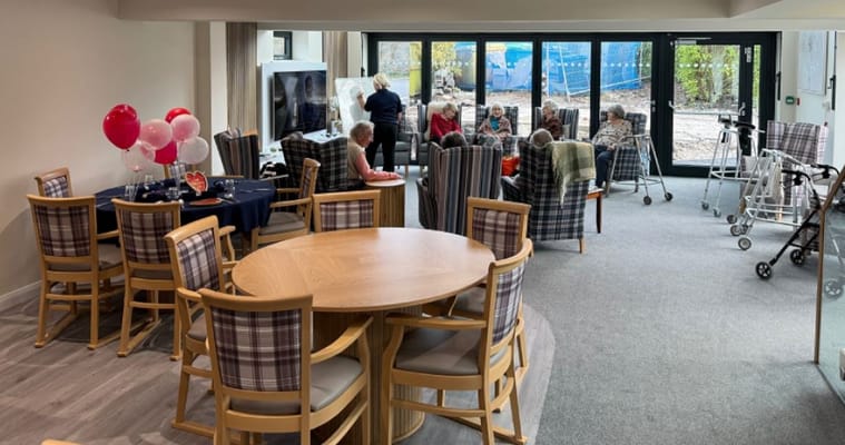 Residents and staff engaged in a common area activity