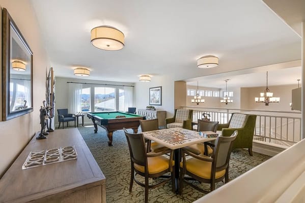 Common area with game tables and comfortable seating