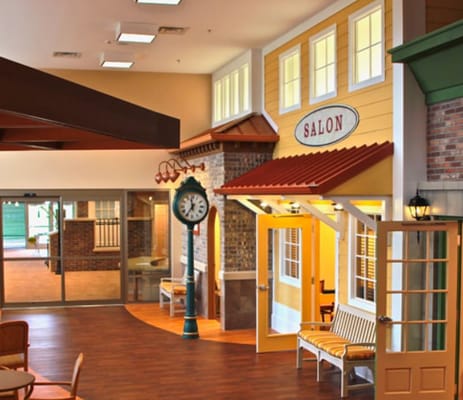 Interior view of the salon area featuring a clock and seating