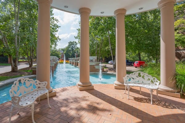 Outdoor seating area with a water feature