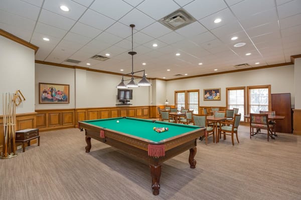 Interior view of a recreation room with a pool table.