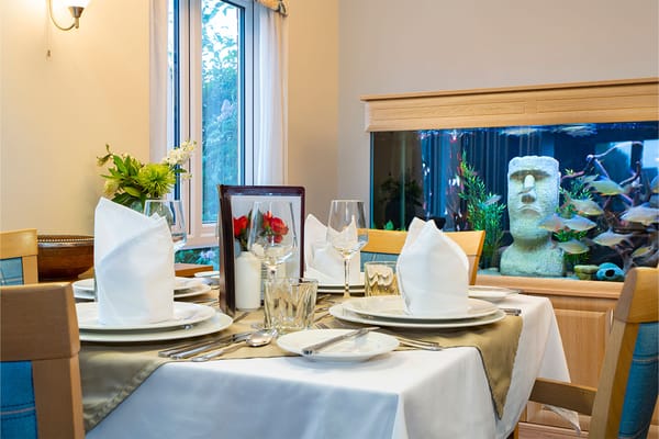 Elegant dining table setting with aquatic decor