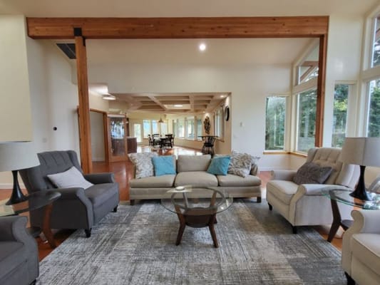 Inviting living room with comfortable seating and large windows