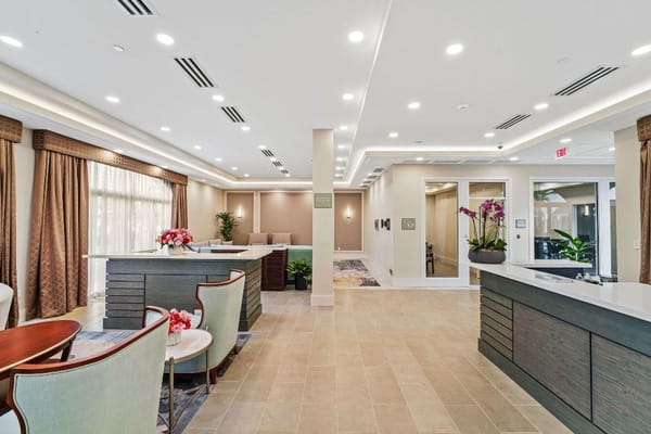 A modern and inviting lobby with seating and decorative plants.