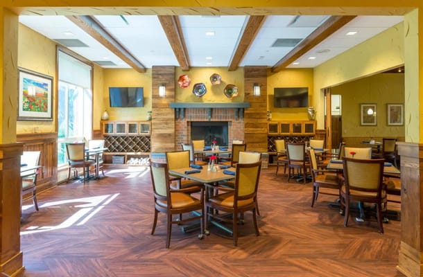 Cozy dining area with tables and a fireplace