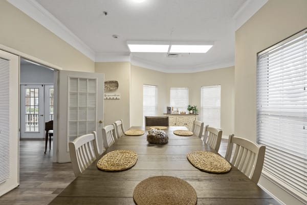 Interior view of a dining room with wooden table