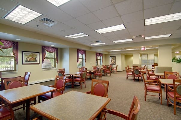 Bright and spacious dining area with tables and chairs