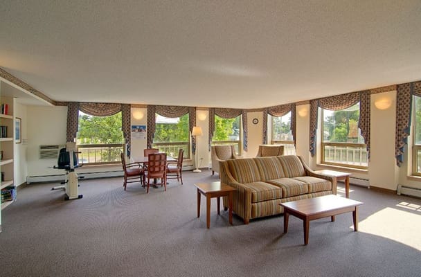 Bright living room with large windows and comfortable seating
