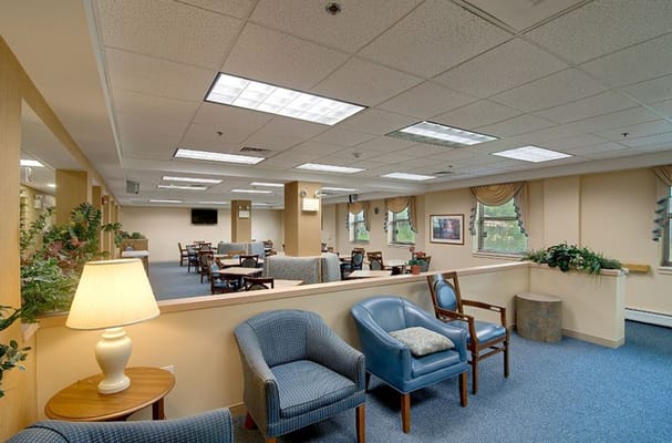 Spacious common area with seating and tables