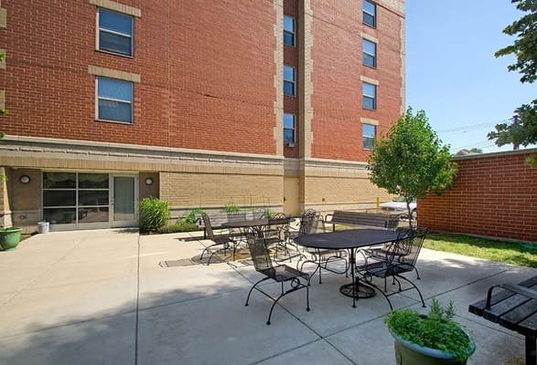 Outdoor patio area with tables and chairs