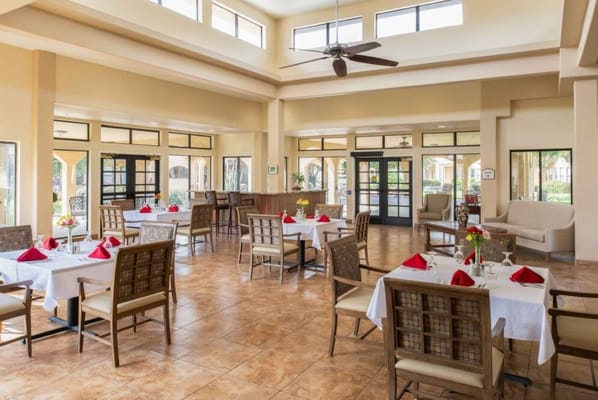 Well-decorated dining room with tables set for a meal