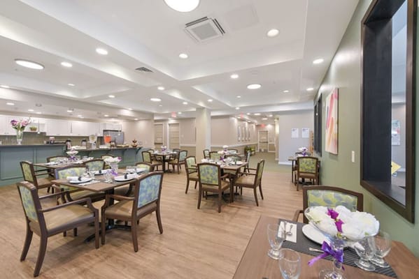 Bright dining area with tables set for meals