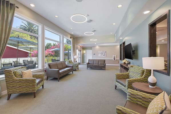 Inviting living room with large windows and comfortable seating