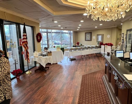 View of the dining area with buffet setup and holiday decorations.