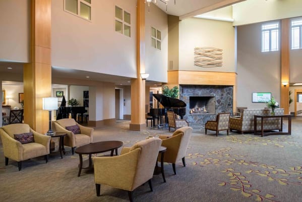 Welcoming lobby with seating and a fireplace
