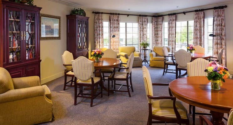 Cozy common area with seating and floral arrangements