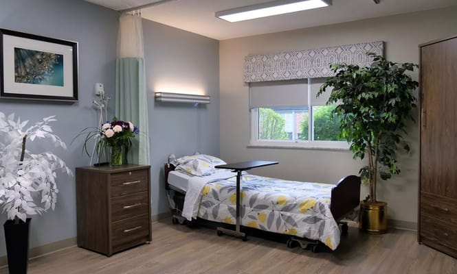 A private resident room with a bed and decorations