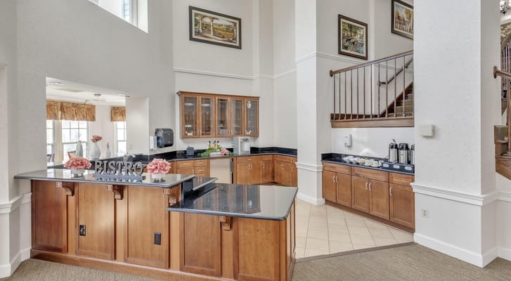 Interior view of the bistro area with a bar counter and cabinets.