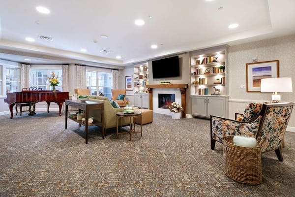 Cozy common area with seating and a piano