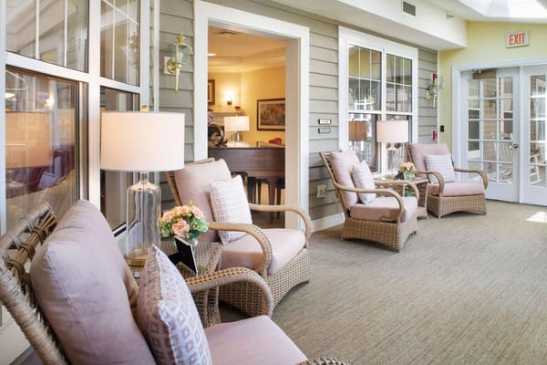 Cozy lounge area with wicker chairs and decorative lamps