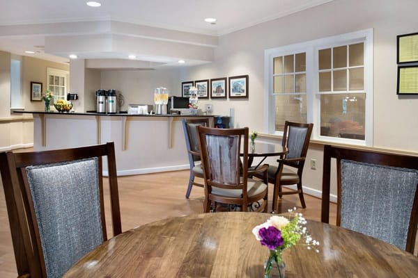 Cozy common area with seating and a refreshment bar