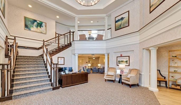 Bright and inviting lobby with staircase and reception area