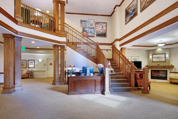 Spacious lobby featuring a staircase and reception area