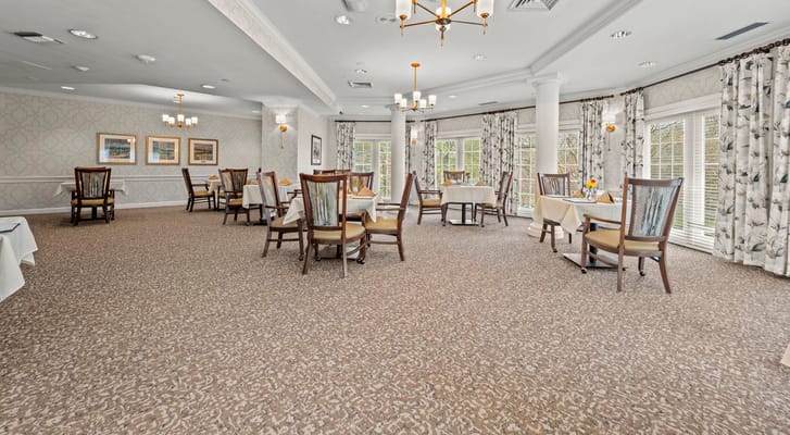 Dining room with tables set for residents