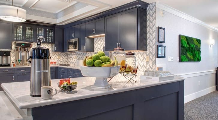 Well-equipped kitchen with fruit bowl and beverages