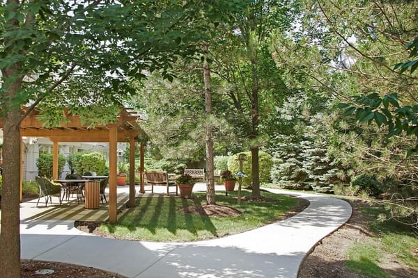 A serene outdoor space with a path and seating area