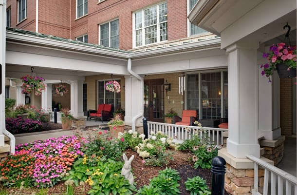 Vibrant flower garden and seating area on the porch