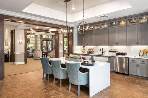 Modern kitchen and dining area in senior living facility