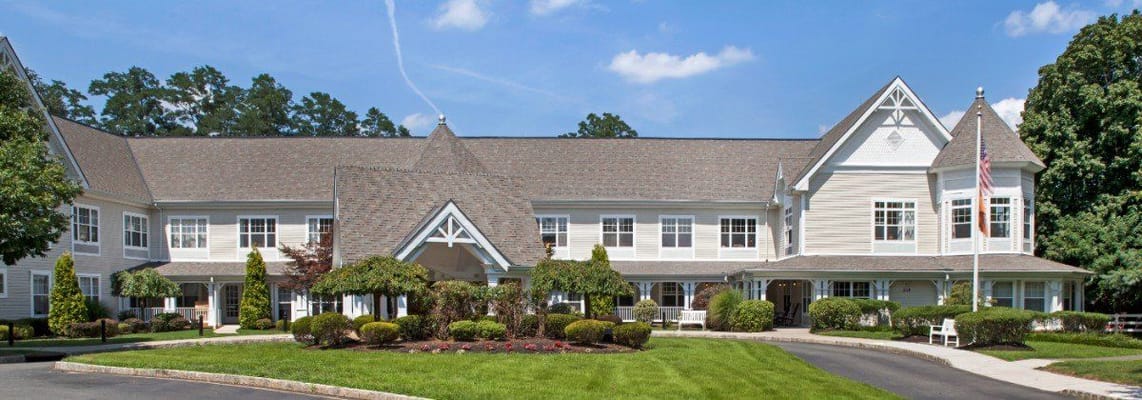 View of the exterior of Sunrise of Lincroft with landscaped gardens