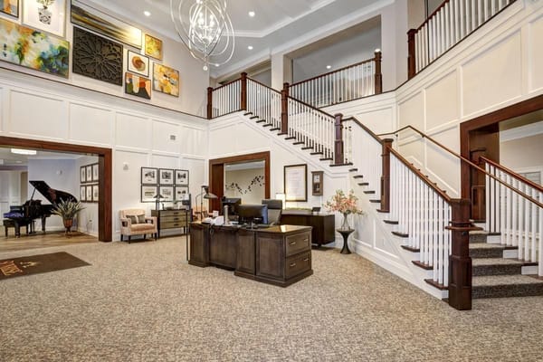 Elegant lobby with reception area and staircase