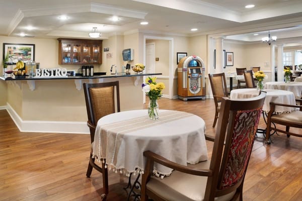 Interior view of the bistro area with table settings and a jukebox