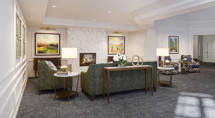 Comfortable living room with green sofas and artwork