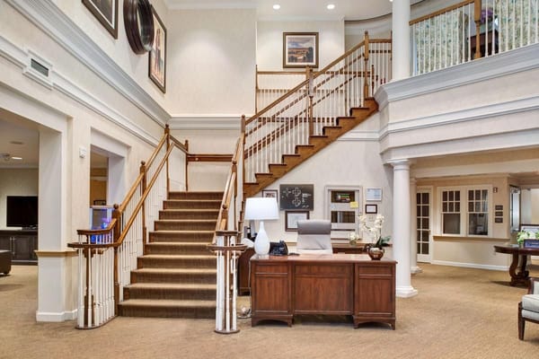 Bright interior lobby area with staircase and seating